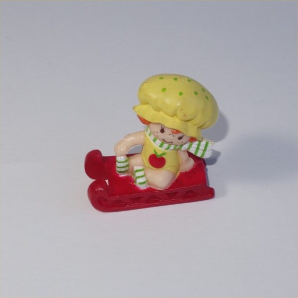 Strawberry Shortcake 1982 Apple Dumplin on Sled PVC Figurine